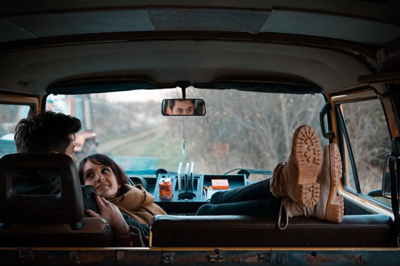 Man and women sat in campervan
