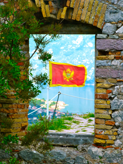 View through stone window of flag