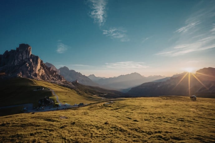 Sunlight breaking over a rugged mountain ridge