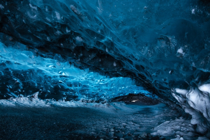 Electric-blue glacier ice cave in Iceland
