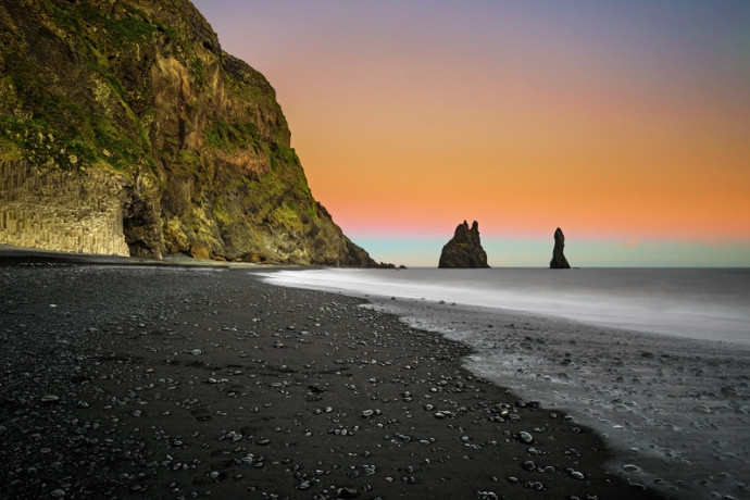 Sea stacks at sunset on Reynisfjara black sand beach, Iceland