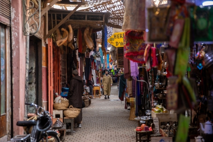 Colourful Marrakech souk lined with lanterns and baskets in winter