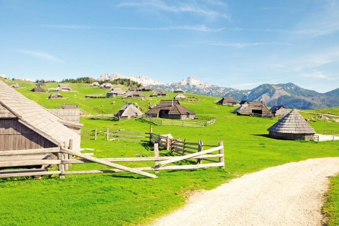 Adventure travel in Slovenia includes mountain huts on Velika Planina